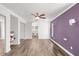 Bright bedroom with new floors, ceiling fan, closet, and connected bathroom at 210 Lee St, Oldsmar, FL 34677