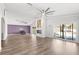 Spacious living room featuring vaulted ceilings, a cozy fireplace, and an open layout perfect for gatherings at 210 Lee St, Oldsmar, FL 34677