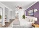 Serene main bedroom with a walk-in closet and en-suite bathroom, offering a private retreat at 210 Lee St, Oldsmar, FL 34677