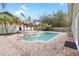 Inviting backyard pool and spa with a tiki bar and a brick-paved patio at 210 Lee St, Oldsmar, FL 34677