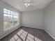 Neutral bedroom with a large window providing plenty of natural light and plush carpeting for warmth at 24156 Buckingham Way, Punta Gorda, FL 33980