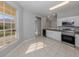 Bright and airy kitchen with stainless steel appliances, granite countertops, and an eat-in area providing ample space at 24156 Buckingham Way, Punta Gorda, FL 33980