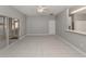 Spacious living area with tile floors and natural light provides an open and inviting atmosphere for entertaining at 24156 Buckingham Way, Punta Gorda, FL 33980