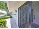 Home exterior boasts a secure front door, manicured landscaping, and an attached garage at 2421 Lancaster Dr, Sun City Center, FL 33573