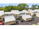 Exterior view of well-maintained townhomes featuring reserved parking and lush landscaping in a desirable community at 3406 Waterbridge Dr, Tampa, FL 33618