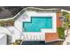 Aerial view of the community pool offering a refreshing escape with lounge chairs and a wooden deck at 3406 Waterbridge Dr, Tampa, FL 33618