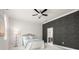 Bright bedroom with a bed, statement wall, and an ensuite bathroom entrance at 7602 S Desoto St, Tampa, FL 33616