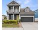 Charming two-story home features a welcoming porch, manicured lawn and attached two-car garage at 7602 S Desoto St, Tampa, FL 33616