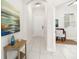 Bright hallway with tile floors, leading to a front door and a glimpse of the office space at 7602 S Desoto St, Tampa, FL 33616