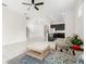Bright, open-concept living area with tile flooring and access to the modern kitchen at 7602 S Desoto St, Tampa, FL 33616