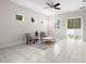 Cozy living room with tile floors, bright natural light, and comfortable seating; perfect for relaxing or entertaining at 7602 S Desoto St, Tampa, FL 33616