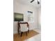 Office space featuring a desk, chair, and a window with blinds, bathed in natural light at 7602 S Desoto St, Tampa, FL 33616