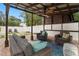 Inviting covered patio with comfortable seating and stylish decor, perfect for outdoor relaxation and entertaining at 7602 S Desoto St, Tampa, FL 33616