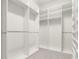 A spacious walk-in closet is well-organized with shelving and hanging rods at 7602 S Desoto St, Tampa, FL 33616