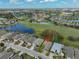 An aerial view of the home and the community, featuring manicured landscaping at 1123 Emerald Dunes Dr, Sun City Center, FL 33573