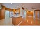 Spacious kitchen with modern appliances and an eat-in bar, flowing into the adjacent living area for easy entertaining at 1123 Emerald Dunes Dr, Sun City Center, FL 33573
