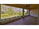 Enclosed lanai with brick flooring and great view of the community landscape at 1123 Emerald Dunes Dr, Sun City Center, FL 33573