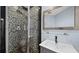 Modern bathroom featuring unique tile work in the glass enclosed shower at 1209 E Cumberland Ave # 505, Tampa, FL 33602