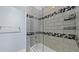 Modern bathroom with a tub, glass enclosure, and stylish tile accents for a spa-like feel at 1209 E Cumberland Ave # 505, Tampa, FL 33602