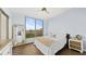 Bright bedroom with large window, neutral tones, and wood flooring for a cozy retreat at 1209 E Cumberland Ave # 505, Tampa, FL 33602