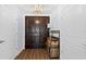 Entryway with double doors, wood floors, and a decorative shelf at 1209 E Cumberland Ave # 505, Tampa, FL 33602