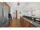 Modern kitchen with stainless steel appliances, granite countertops, and ample cabinet space at 1209 E Cumberland Ave # 505, Tampa, FL 33602