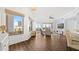 Bright living room with wood floors, neutral decor, and large windows offering city views at 1209 E Cumberland Ave # 505, Tampa, FL 33602