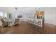 Open floor plan with kitchen island and living room featuring views from floor-to-ceiling windows at 1209 E Cumberland Ave # 505, Tampa, FL 33602