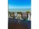 Relaxing balcony with seating that overlooks a beautiful ocean view and blue skies at 16330 Gulf Blvd # 306, Redington Beach, FL 33708