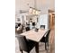 Contemporary dining area with modern lighting, a marble table, and easy access to the kitchen at 16330 Gulf Blvd # 306, Redington Beach, FL 33708