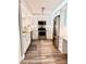 Well-lit kitchen with stainless steel appliances, white cabinetry, and wood-look flooring at 16330 Gulf Blvd # 306, Redington Beach, FL 33708