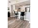Kitchen with stainless appliances, stone backsplash, granite counters, and bar seating at 16330 Gulf Blvd # 306, Redington Beach, FL 33708