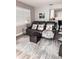Comfortable living room with a leather sofa, ottoman, and a view of the kitchen at 16330 Gulf Blvd # 306, Redington Beach, FL 33708