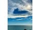 Beautiful ocean and sky view showcasing birds flying above the water and clouds at 16330 Gulf Blvd # 306, Redington Beach, FL 33708