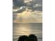 Incredible ocean view with sun rays and a sail boat at 16330 Gulf Blvd # 306, Redington Beach, FL 33708