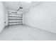 Spacious garage with white walls, sealed concrete floors, and an insulated garage door at 31349 Cabana Rye Ave, San Antonio, FL 33576
