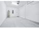 Spacious garage with white walls, sealed concrete floors, and an insulated garage door at 31349 Cabana Rye Ave, San Antonio, FL 33576