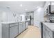 Modern kitchen featuring stainless steel appliances, white countertops, and light gray cabinetry at 31349 Cabana Rye Ave, San Antonio, FL 33576