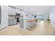 Modern kitchen boasts stainless appliances, barstool seating, and an open layout to the living area at 31349 Cabana Rye Ave, San Antonio, FL 33576