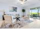 Cozy living room featuring a comfortable seating arrangement, area rug, and sliding glass doors at 31349 Cabana Rye Ave, San Antonio, FL 33576