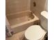 Cozy bathroom featuring a standard tub and toilet at 4405 W Fair Oaks Ave # 10, Tampa, FL 33611