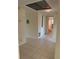 Hallway featuring tile flooring with ample closet space and access to a bathroom at 6170 7Th N Ave, St Petersburg, FL 33710