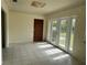 Bright room featuring tile floors, french doors, and natural light from the windows at 6170 7Th N Ave, St Petersburg, FL 33710