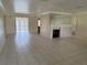 Spacious living room featuring tile flooring and a decorative fireplace, with an open floor plan at 6170 7Th N Ave, St Petersburg, FL 33710