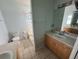 Bathroom with tiled floors, tiled shower/tub, vanity and neutral paint at 6190 107Th N Ave, Pinellas Park, FL 33782