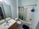 Bathroom with tiled floors, tiled shower/tub, vanity and large mirror at 6190 107Th N Ave, Pinellas Park, FL 33782
