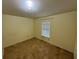 View of a bedroom that is painted yellow, and shows tile flooring with neutral blinds at 6190 107Th N Ave, Pinellas Park, FL 33782