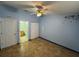 Bright bedroom with ceiling fan, closet and easy access to the bathroom at 6190 107Th N Ave, Pinellas Park, FL 33782