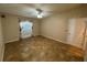 Bright bedroom with ceiling fan, window, tile floors and neutral walls at 6190 107Th N Ave, Pinellas Park, FL 33782