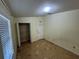 This bedroom offers tile flooring and a closet for storage solutions at 6190 107Th N Ave, Pinellas Park, FL 33782